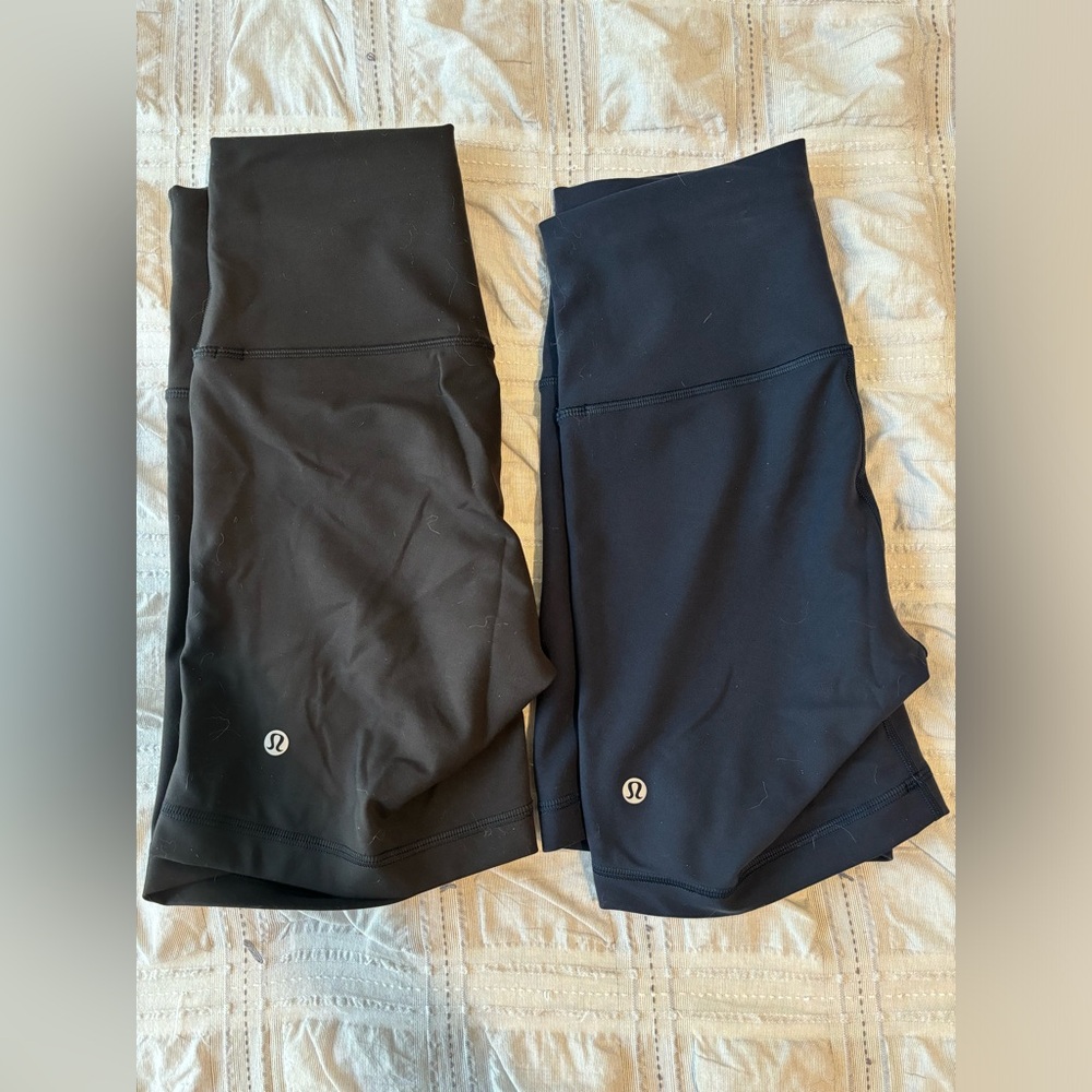Selling TWO pairs of Wunder Train High-Rise shorts 6”, both size 6. Navy & black